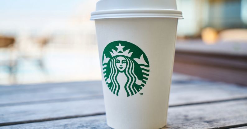 Brand Identity - Closed White and Green Starbucks Disposable Cup