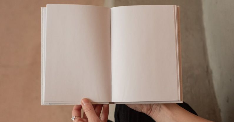 Brand Story - Woman holding book with blank pages