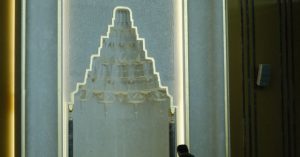 Niche Marketing - A man stands in front of a large mosque