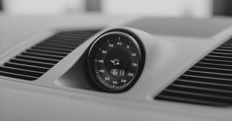 Analytics Dashboard - A Clock on the Dashboard of a Luxury Car
