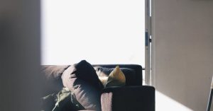 Accessible Design - Brown Couch Near Pillows and Mats