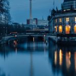 Mobile-first - The berlin skyline is reflected in the water