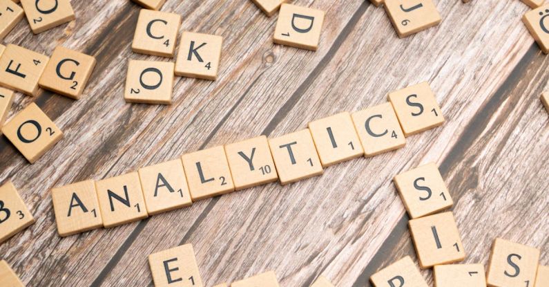 Predictive Analytics - The word analytics spelled out in scrabble tiles
