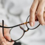 E-commerce Analytics - Person Holding Brown Framed Eyeglasses